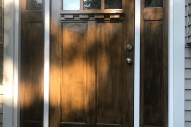 Entryway - entryway idea in Bridgeport with a dark wood front door