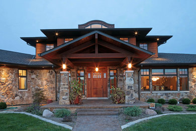 Inspiration for a timeless single front door remodel in St Louis with a medium wood front door