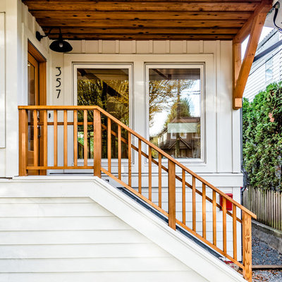 Example of a classic entryway design in Vancouver with a glass front door