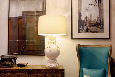 Example of a mid-sized eclectic medium tone wood floor and brown floor foyer design in New York with white walls