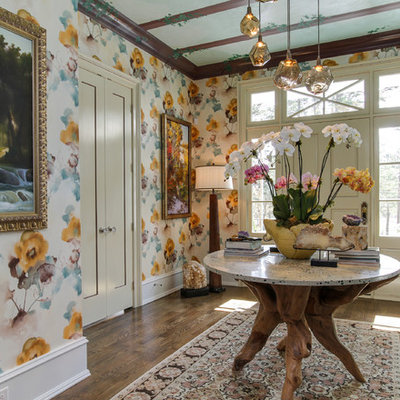 Mid-sized eclectic dark wood floor and brown floor entryway photo in Raleigh with multicolored walls and a white front door
