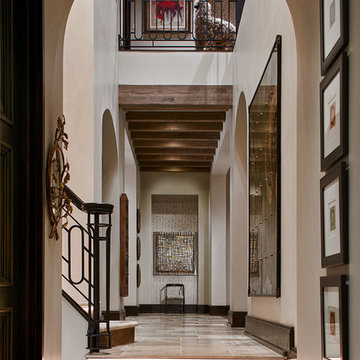 Elegant Archway in T-Shaped Foyer with Illuminated Stairs