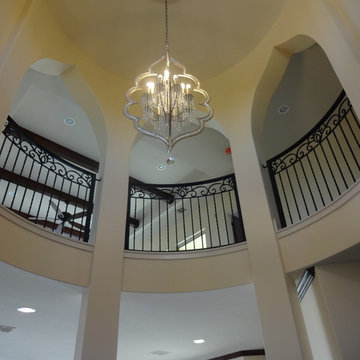 Elegant entry foyer with wrought iron railings