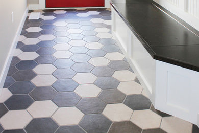 Mid-sized trendy multicolored floor entry hall photo in Cedar Rapids with beige walls