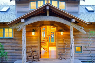 Design ideas for a rustic porch in Boston with a single front door.