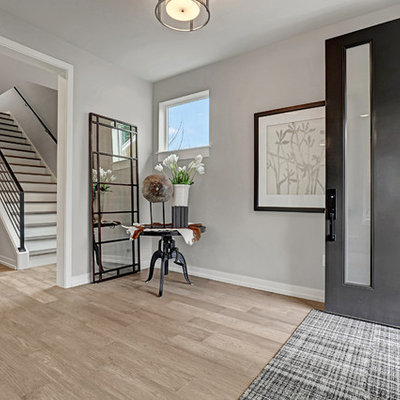 Entryway - large cottage medium tone wood floor entryway idea in Seattle