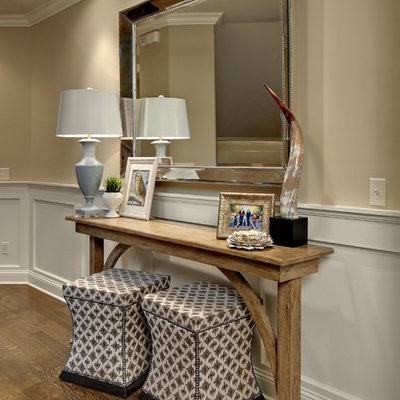 Elegant entry hall photo in Minneapolis with beige walls