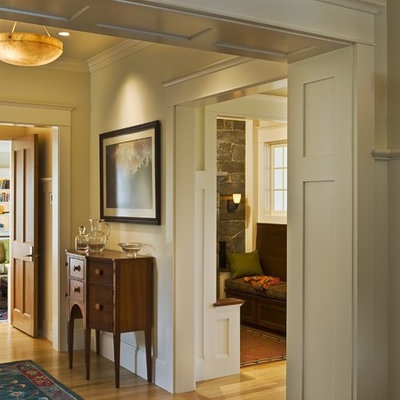 Example of a classic light wood floor entryway design in Burlington with beige walls