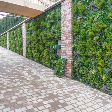Entry Way to Car Lot Upgraded with Fake Green Walls