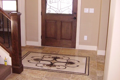 Entryway - ceramic tile entryway idea in Denver with beige walls and a medium wood front door