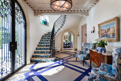 Mediterranean foyer in Miami with a double front door, a glass front door and multi-coloured floors.