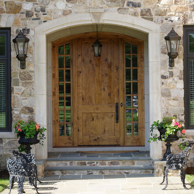 Entryway - traditional entryway idea in Richmond with a medium wood front door