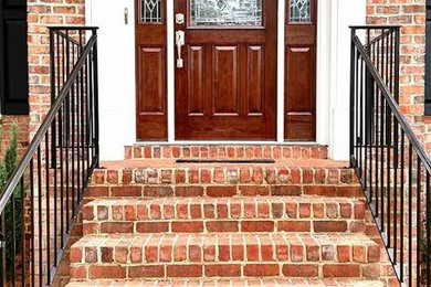 Example of an entryway design in Raleigh with a medium wood front door