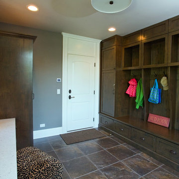 Family Workshop Rear Entry Featuring Lockers, Cabinetry and Mom's Desk