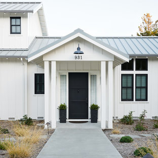 Country entryway photo in San Francisco with a black front door