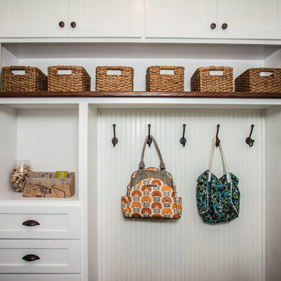 Mudroom - small farmhouse dark wood floor and brown floor mudroom idea in Orlando with gray walls