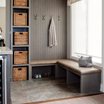 Example of a mid-sized farmhouse porcelain tile mudroom design in Toronto with gray walls
