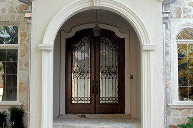 Entryway - mid-sized traditional entryway idea in Toronto with a dark wood front door
