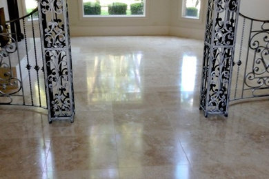 Mid-sized elegant marble floor and beige floor foyer photo in Dallas with beige walls