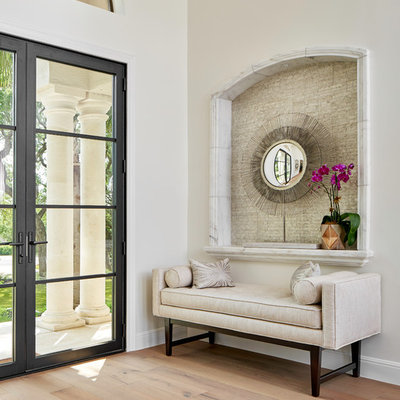 Entryway - large transitional light wood floor and gray floor entryway idea in Austin with white walls and a glass front door
