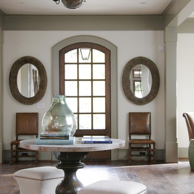 Elegant dark wood floor entryway photo in Atlanta with white walls