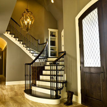 Foyer Features Double Arch Top White Oak Leaded Glass Doors