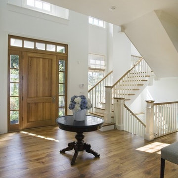 Foyer featuring Millmade Staircase, White Oak Front Door and White Oak Floors