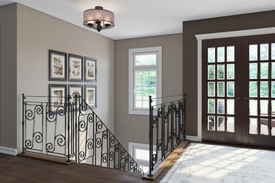 Design ideas for a large classic foyer in Detroit with brown walls, dark hardwood flooring, a double front door, a glass front door and brown floors.