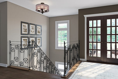 Large transitional dark wood floor and brown floor entryway photo in Detroit with brown walls and a glass front door