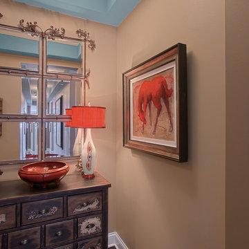 Foyer with Art Work, Distressed Chest and Orange Lamp Shade