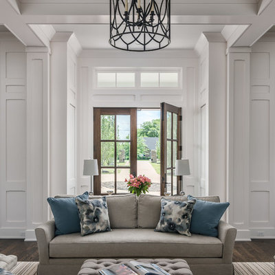 Inspiration for a large cottage dark wood floor and brown floor entryway remodel in Nashville with white walls and a dark wood front door