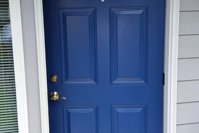 Example of a 1950s single front door design in Seattle with a blue front door