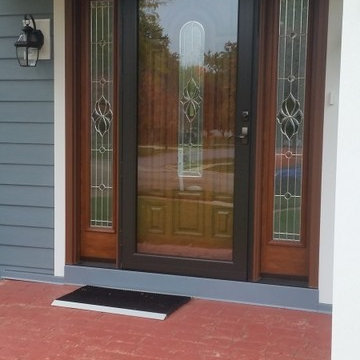 Front Door with Storm Door & Blue Hardie Plank Siding