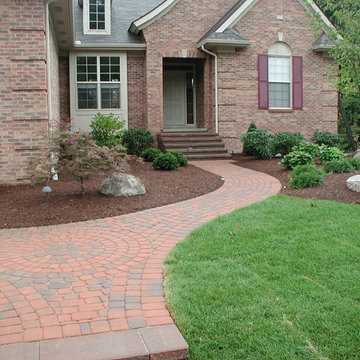 Front yard landscaping with back yard patio and pond
