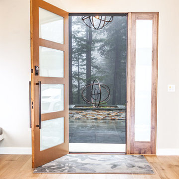 Frosted Glass and Wood Frame Front Door Entry in Passive House