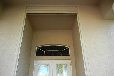 Inspiration for a single front door remodel in Miami with a brown front door