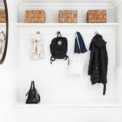 Inspiration for a transitional gray floor mudroom remodel in New York with gray walls