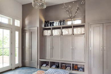 Classic boot room in New York with grey walls and grey floors.