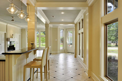 Inspiration for a modern ceramic tile entryway remodel in New Orleans with beige walls and a glass front door