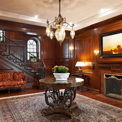 Elegant dark wood floor entryway photo in Montreal