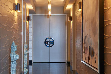 На фото: узкая прихожая среднего размера в современном стиле с серебряными стенами, гранитным полом, двустворчатой входной дверью и коричневым полом с