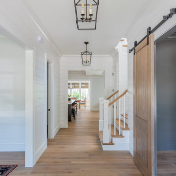Gracious Entry with White Oak Floors and Hanging Lanterns