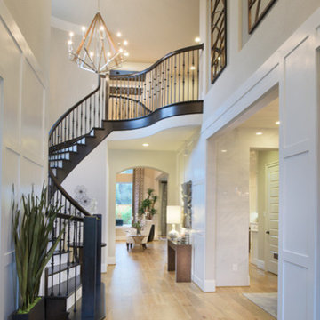 Grand Entryway with Light Wood Floors