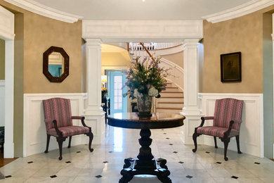 Inspiration for a timeless marble floor entryway remodel in New York