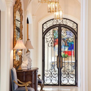 Hallway with Groin Vault Arched Ceiling and Wrought Iron Double Doors