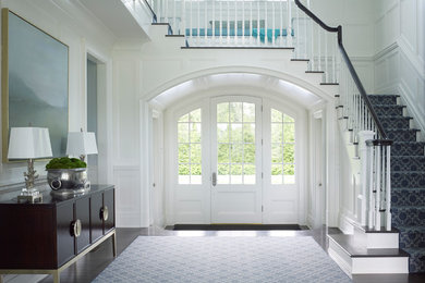 Inspiration for a large classic front door in New York with white walls, a single front door, a white front door, dark hardwood flooring and brown floors.
