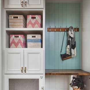 Inspiration for a small transitional beige floor entryway remodel in Denver with multicolored walls