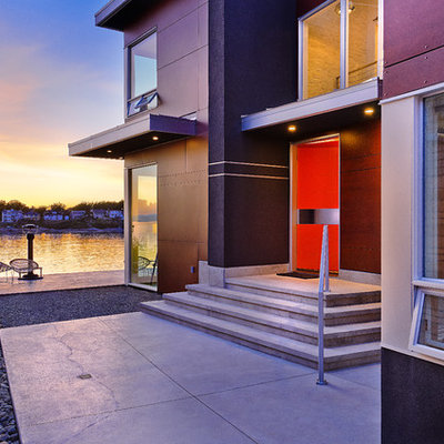 Inspiration for a contemporary single front door remodel in Vancouver with an orange front door