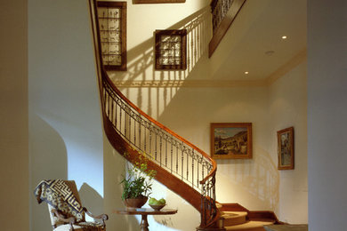 Example of a large tuscan limestone floor foyer design in Phoenix with white walls