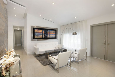 Inspiration for a large contemporary linoleum floor entryway remodel in Miami with white walls and a gray front door